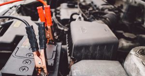 Jumper cables on car battery | Performance Columbus near Columbus, OH