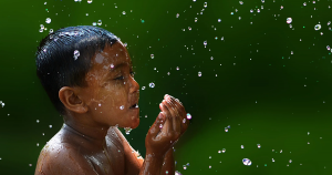Boy playing in water | Performance Columbus near Columbus, OH